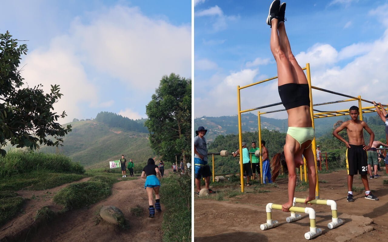 ankle weight lady and kim doing a hanstand at the top of cerro las tres cruces medellin