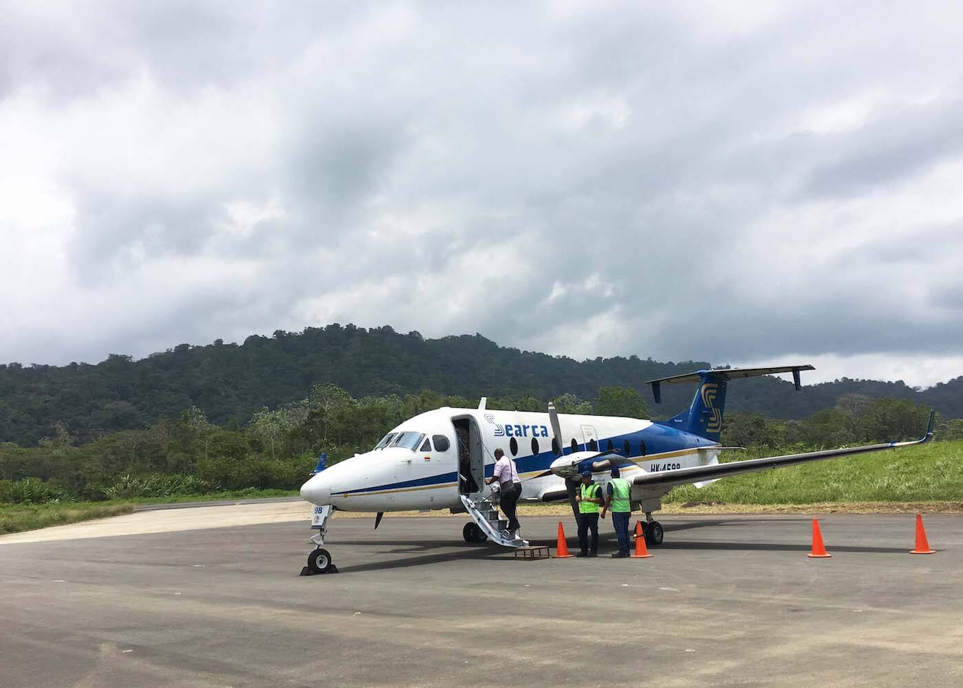 boarding a small plane at Bahia Solano's airport