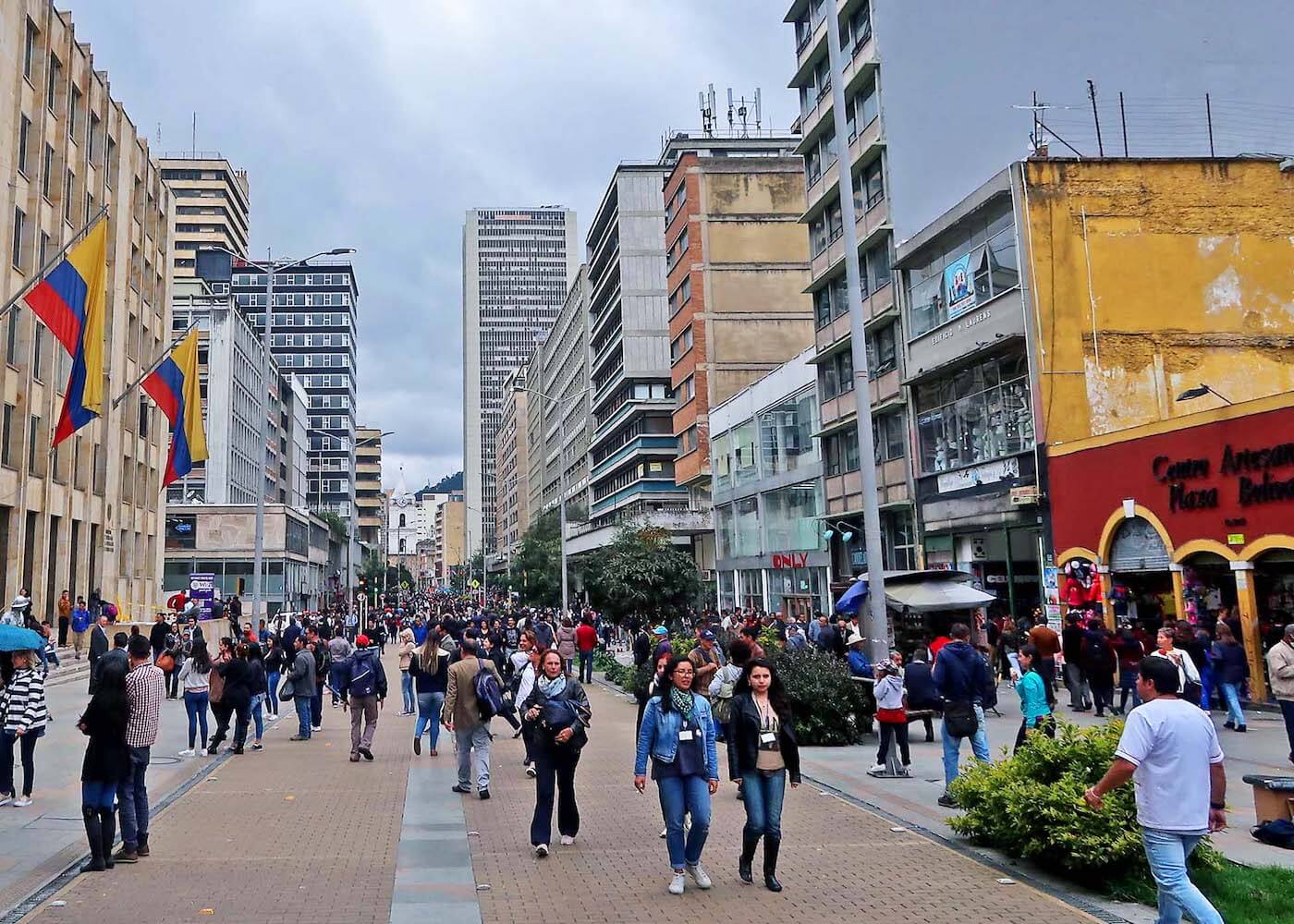 People walking along along Bogota's Carrera 7