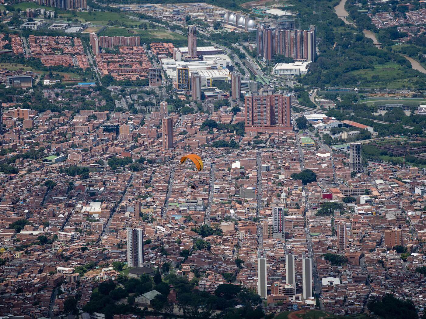 My paraglider with the city of Medellin below