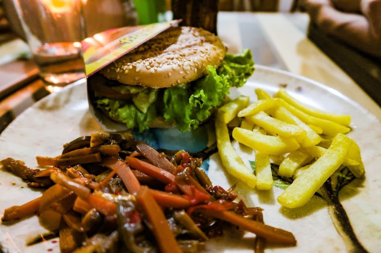 Close-up of burger, veggies, and fries