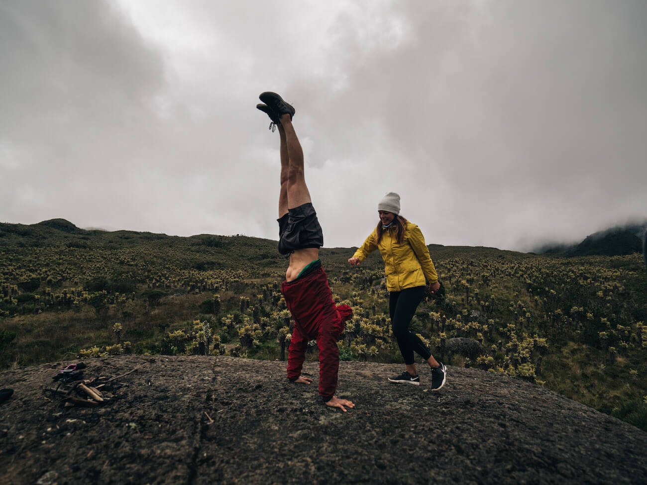 Chris doing handstand on a boulder in the Colombian paramo