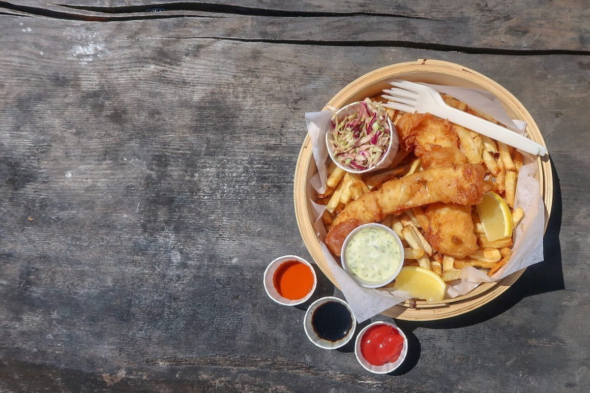 Fish and chips on picnic table from above