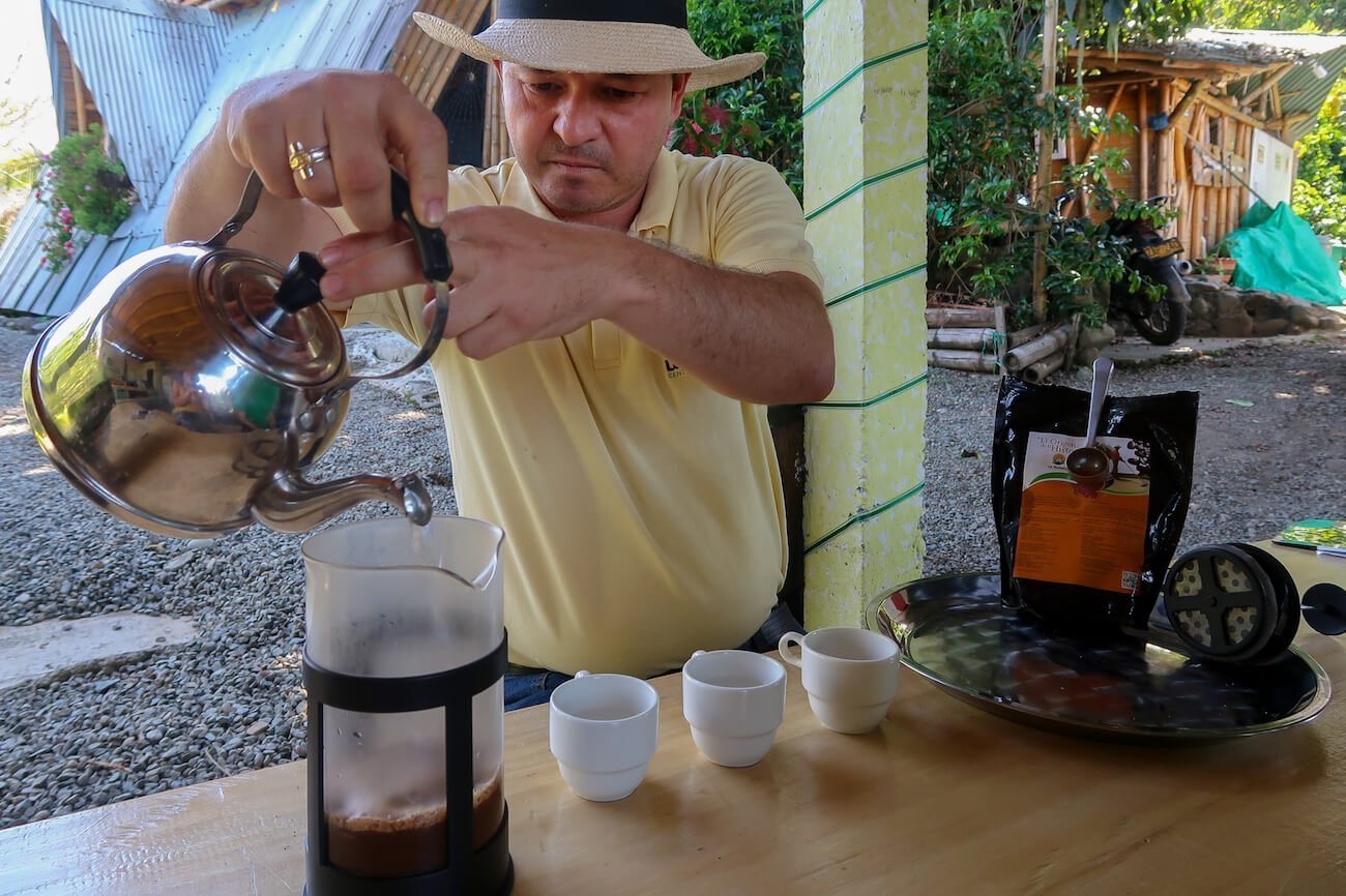 John Wilmar pouring some French press Colombia coffee