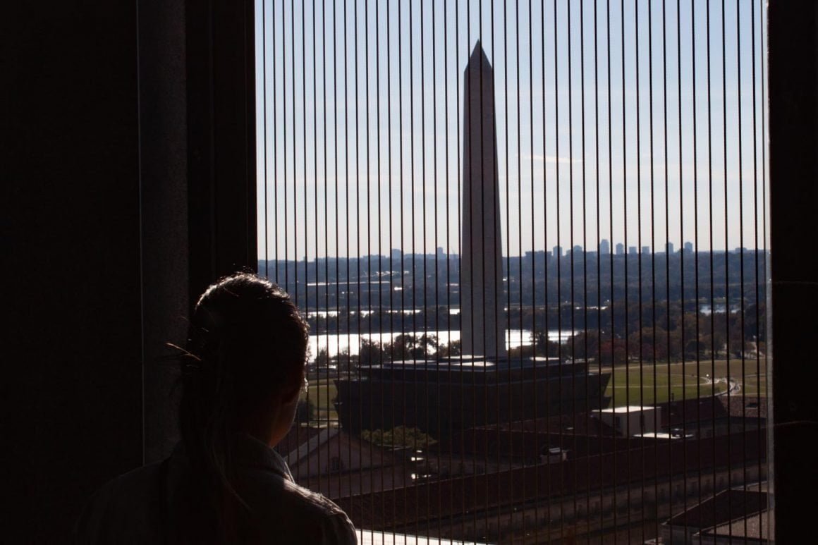 Kim looking at the Washington Monument from the Old Post Office tower.