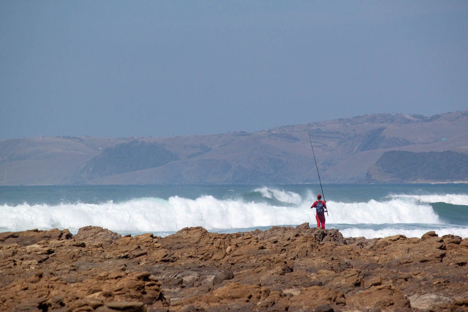 Man fishing on the shore of the Wild Coast