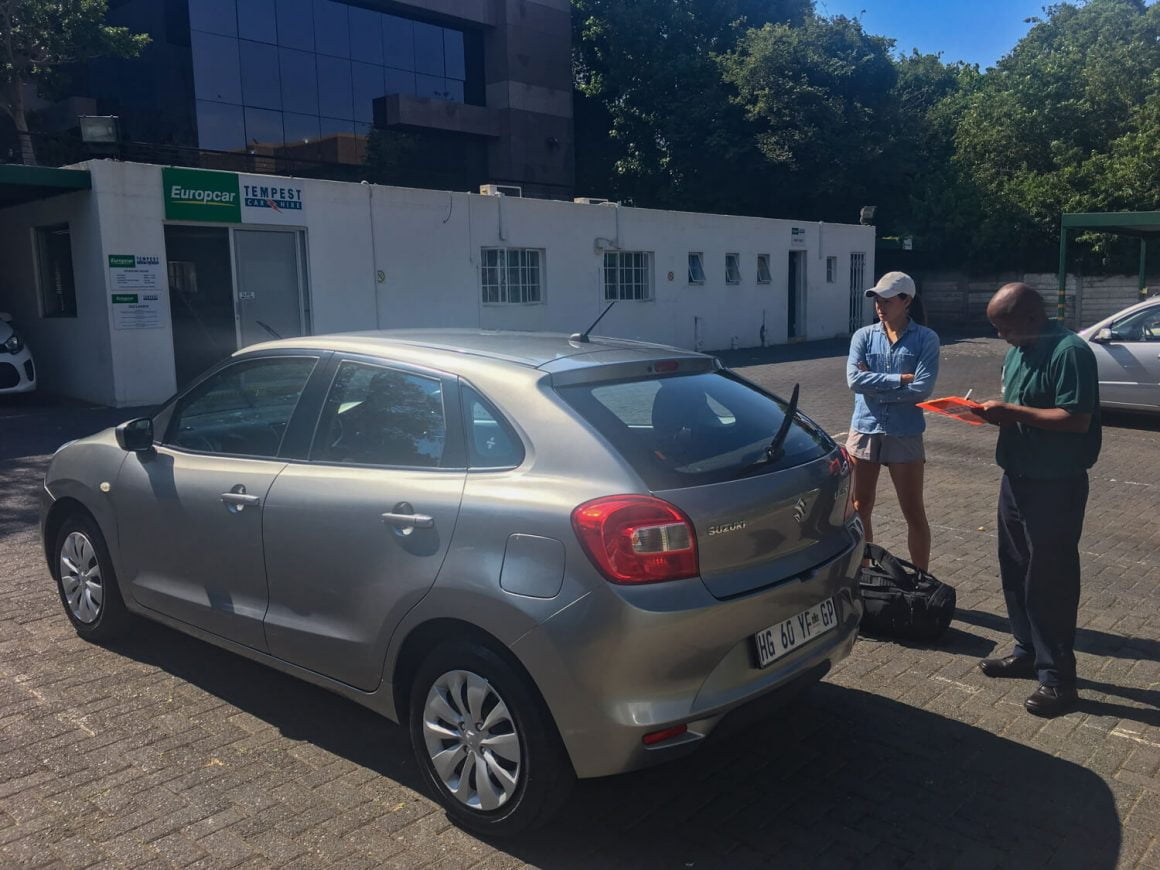 Kim renting our car for our South Africa road trip