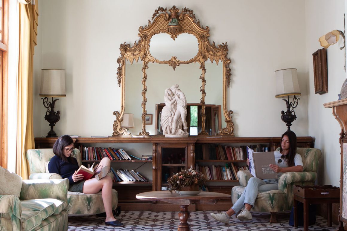 Rebecca and Kim read books inside the lord milner hotel at our pitstop in Matjiesfontein, along Route 62.