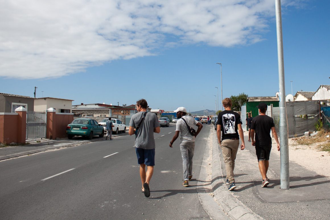 Chris and two others with Siya on a Khayelitsha walking tour. 