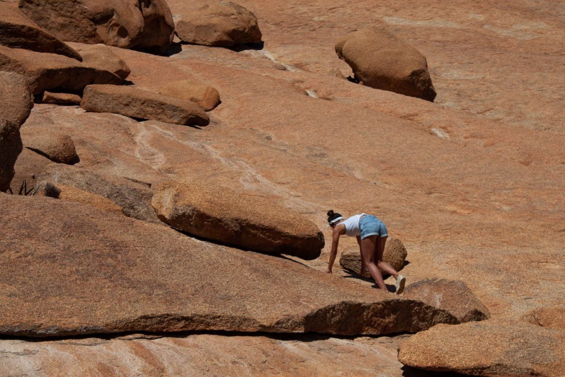 Kim climbs up the unique rock formations in Spitzkoppe