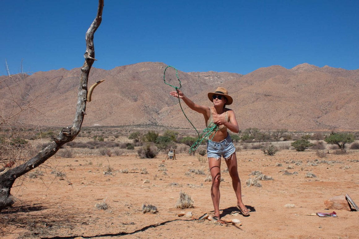 Kim trying to lasso a tree as part of the Adventure Trail, an interactive game the owners of Gecko Camp in Namibia organized for their guests.
