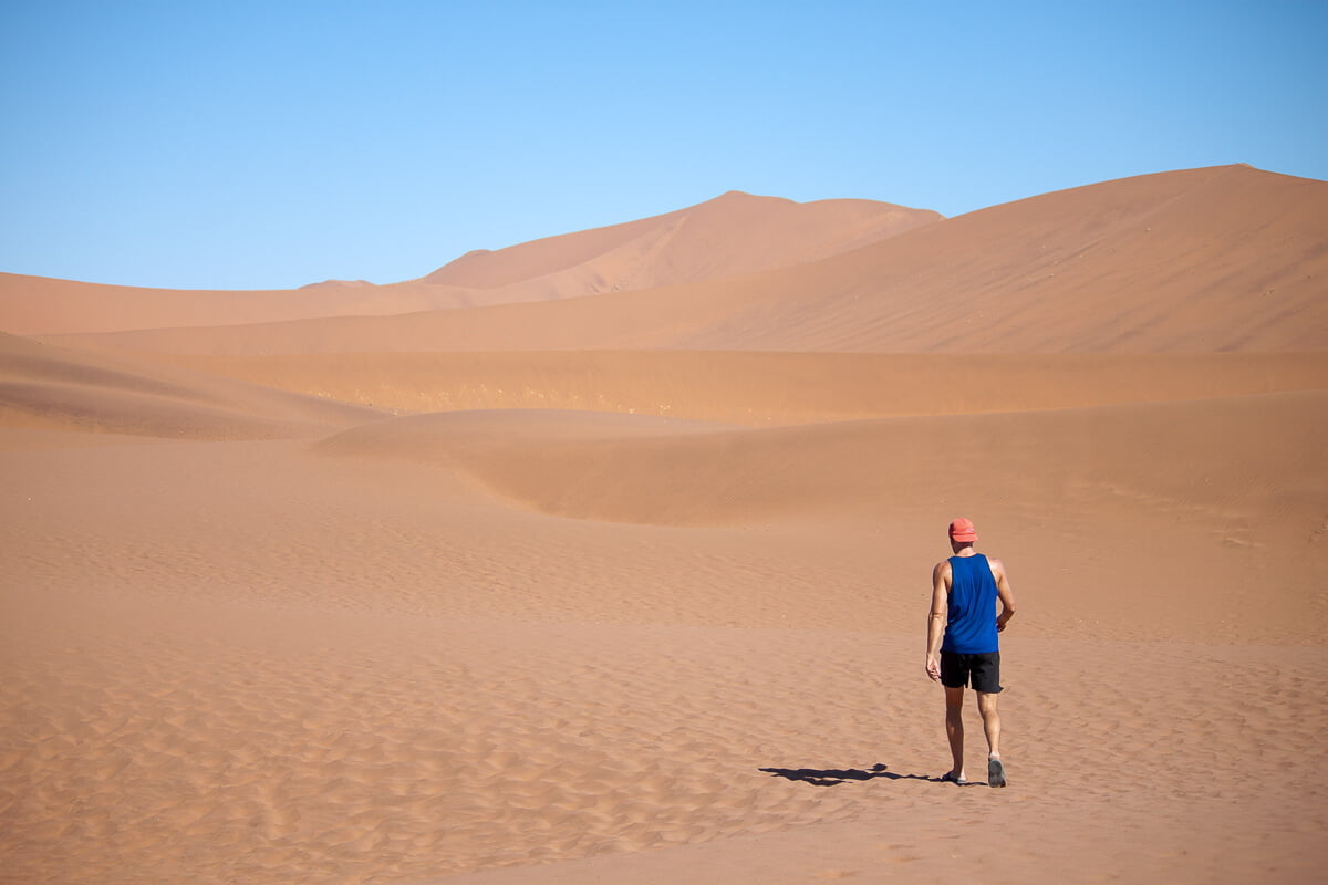 Chris walking alone in the desert