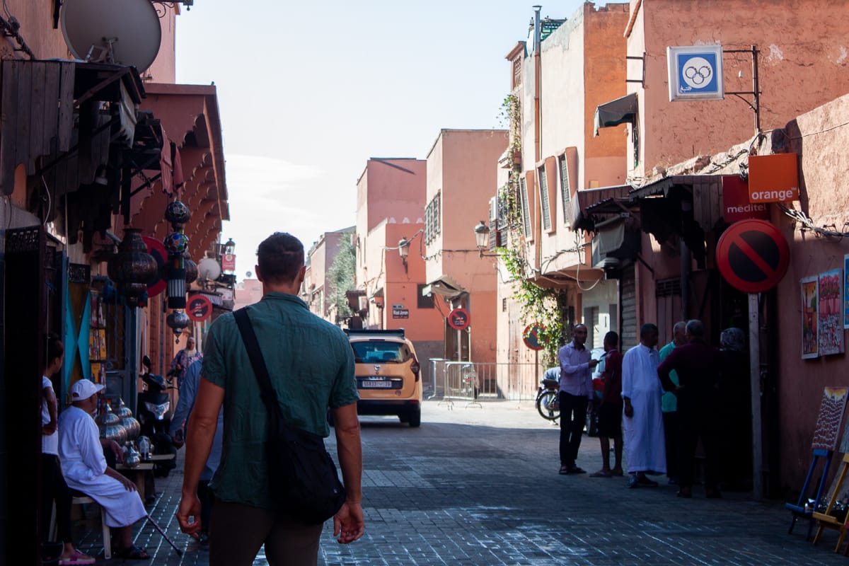 Chris walking the early morning streets of Marrakech in search of a sim card.