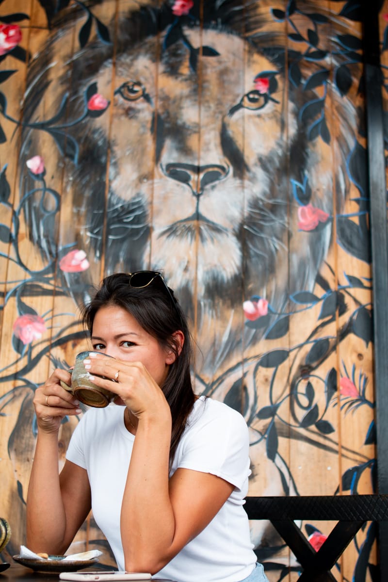 Kim drinking coffee from Imigongo Cafe