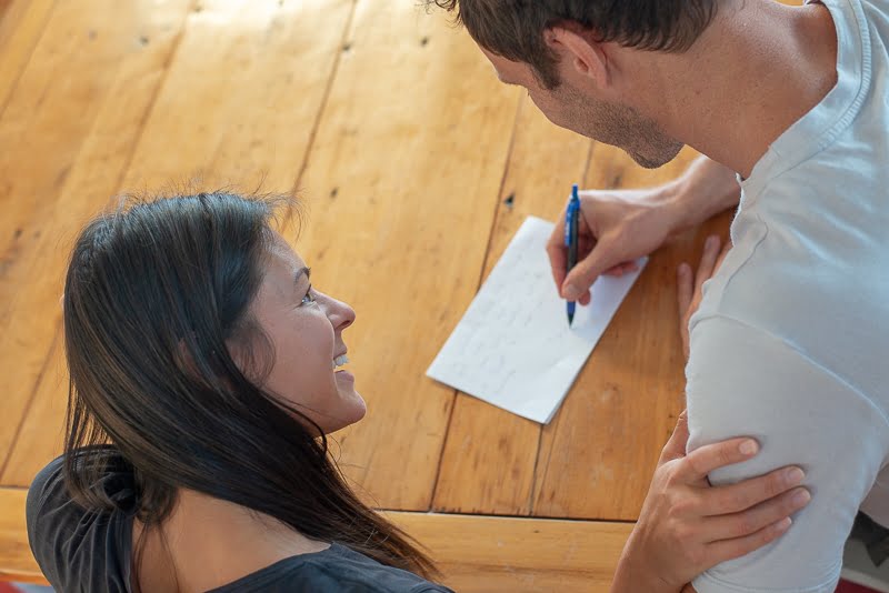 Chris writing down the agreement with Kim